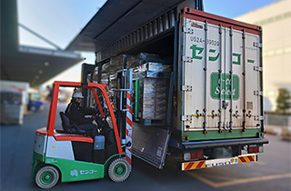 Photo of the goods being loaded onto the truck